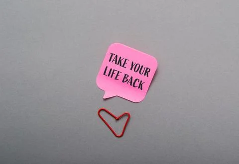 Pink note with the words take your life back written on it Stock Photos