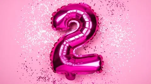 Pink Number Two Balloon with Glitter on Pink Background Stock Footage 333410086
