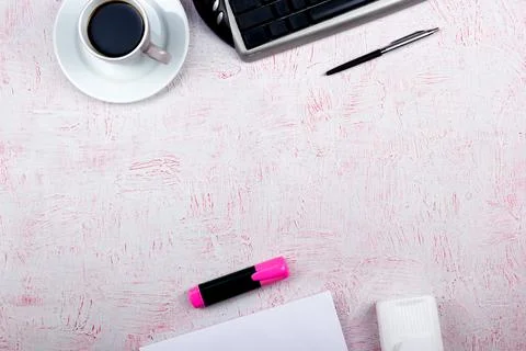 Pink Office desk table with computer, pen and a cup of coffee, lot of thing.. Stock Photos