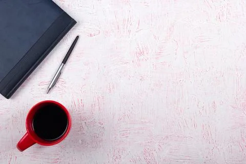 Pink Office desk table with computer, pen and a cup of coffee, lot of thing.. Stock Photos