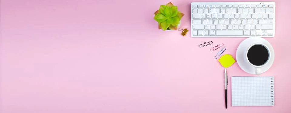 Pink office table with computer, pen and a cup of coffee, lot of things. Top  Stock Photos