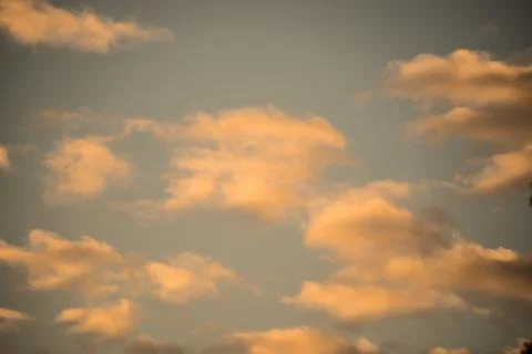 Pink-Orange Wispy Clouds Stock Photos