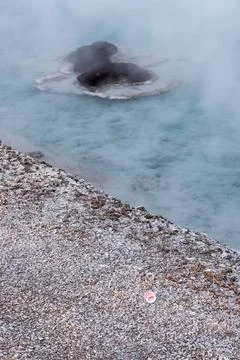 A pink pacifier can be seen pretty close to Excelsior Geyser crater at Yellow Stock Photos