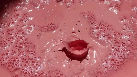 Pink paint liquid splash with bubbles. Stock Footage 161792198
