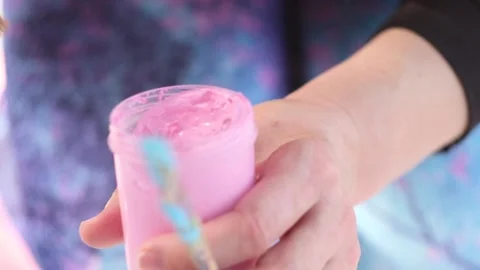 Pink paint in a plastic container. Brush for painting. Stock Footage 120463928