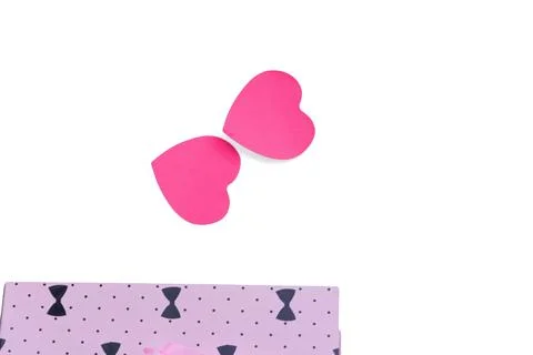 Pink paper heart shapes with patterned fabric on white background Stock Photos