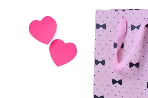 Pink paper heart shapes with patterned fabric on white background Stock Photos