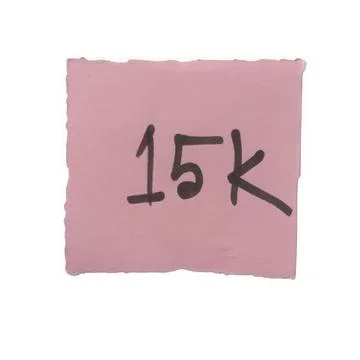 Pink paper note with 15k written in black marker isolated on white background Stock Photos