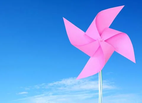 Pink paper windmill in the sky Stock Photos