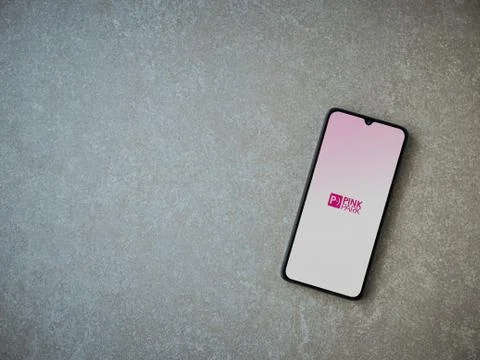 Pink Park app launch screen with logo on the display of a black mobile smartp Stock Photos