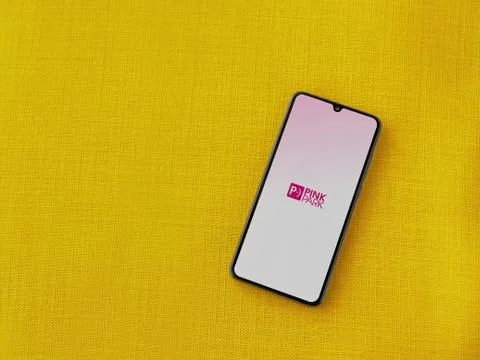 Pink Park app launch screen with logo on the display of a black mobile smartp Stock Photos