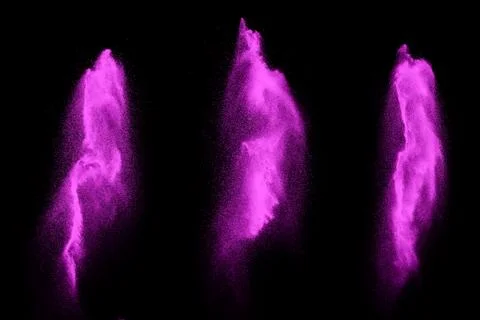 Pink particles splatter on black background. Pink powder exploding. Stock-Fotos