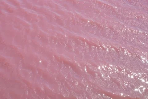 Pink pattern of water waves Stock Photos