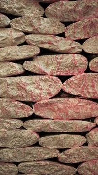 Pink-patterned textured stone blocks. Stock Photos