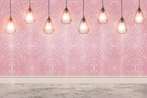 Pink patterned wallpaper and glowing hanging lamps in room Stock Photos
