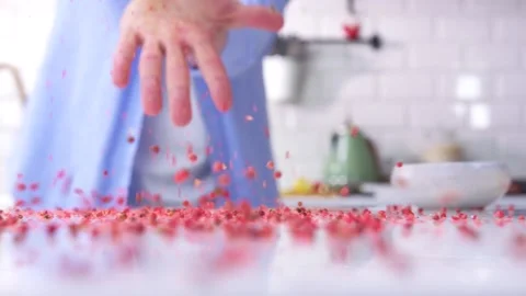Pink pepper and hands. Stock Footage 136878540