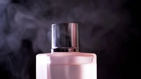 Pink Perfume Bottle Atomizer Spraying Fine Mist On Black Background Stock-Footage 330112304