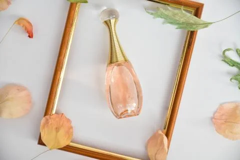 Pink perfume in a frame Stock Photos