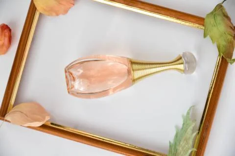 Pink perfume in a frame Stock Photos