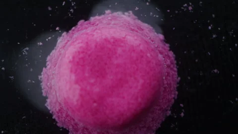 Pink pill dissolving in liquid Stock Footage 255668755