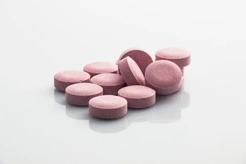Pink pills Stock Photos