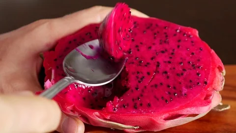 Pink Pitaya or Dragon Fruit On Wooden Table Stock Footage 71836853