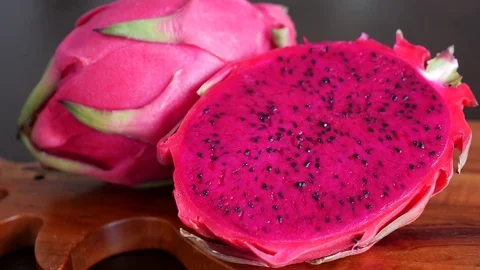 Pink Pitaya or Dragon Fruit On Wooden Table Stock Footage 71836868