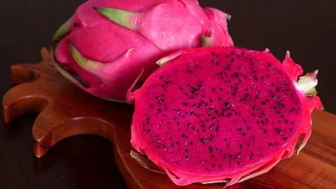 Pink Pitaya or Dragon Fruit On Wooden Table Stock Footage 71890893
