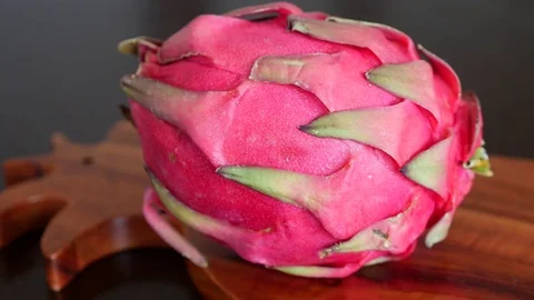 Pink Pitaya or Dragon Fruit On Wooden Table Stock Footage 71891247