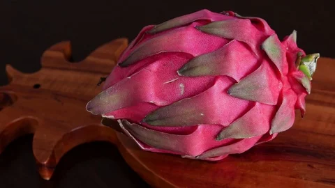 Pink Pitaya or Dragon Fruit On Wooden Table Stock Footage 71891621
