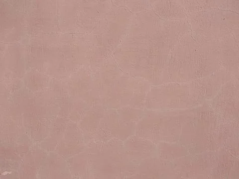 Pink plaster with cracks on the wall texture background Stock-Fotos