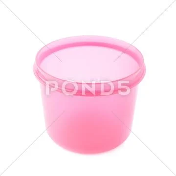 Pink plastic beaker cup isolated over the white background Stock Photos