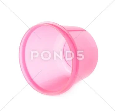 Pink plastic beaker cup isolated over the white background Stock Photos