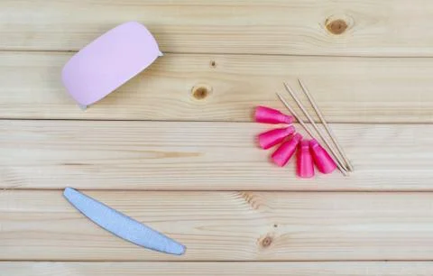 Pink plastic caps for nails. Flatly, top view beauty tools for manicure and p Stock Photos