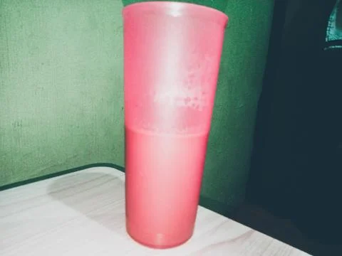 A pink plastic cup from the side Stock Photos