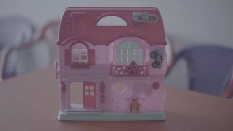 Pink plastic doll's house Video stock 244706773
