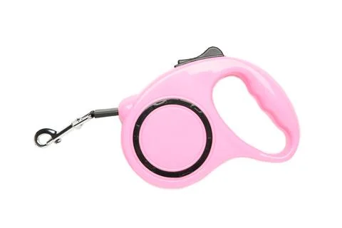 Pink plastic durable and ergonomic leash roulette for pets isolated on white  Stock Photos