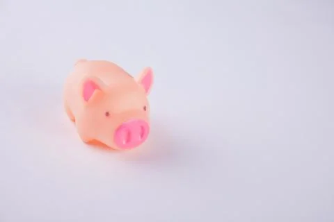 Pink plastic pig on the blue background Stock Photos