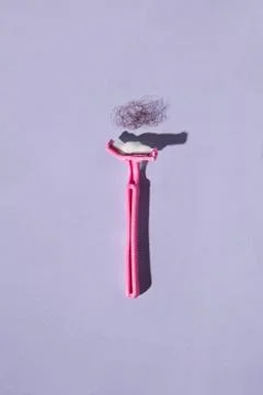 Pink plastic razor concept Foto stock