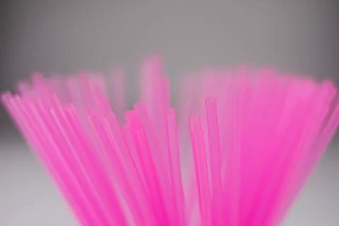 Pink plastic straws for use with drinks such as soft drinks, juices and alcoh Stock Photos
