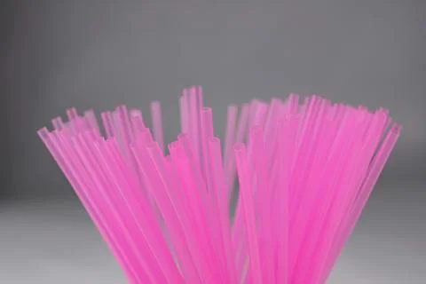 Pink plastic straws for use with drinks such as soft drinks, juices and alcoh Stock Photos