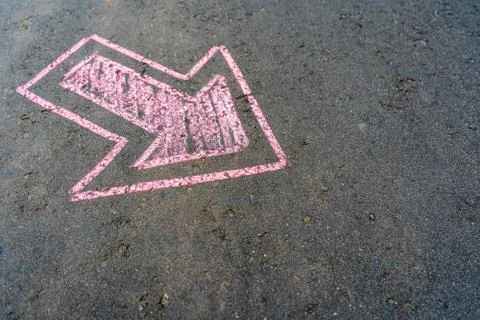 Pink pointer on the asphalt Stock Photos