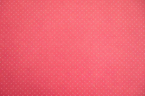 Pink polka dot pattern on fabric with small white dots Stock Photos