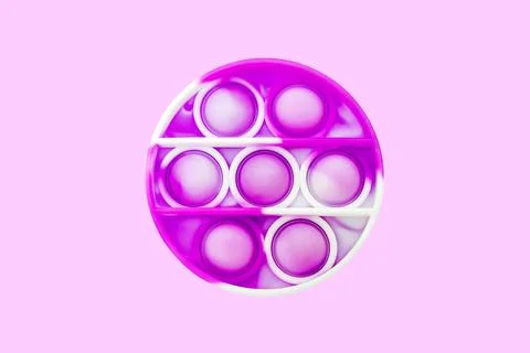 Pink poppit push pop it antistress trendy fidget toy for kids Stock Photos