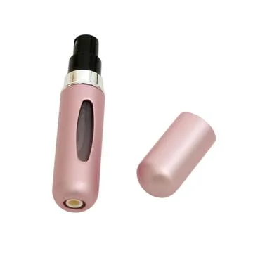 Pink portable perfume atomizer bottle with open cap isolated on white backg.. Stock Photos