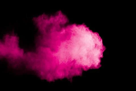 Pink powder explosion cloud on black background. Stock Photos
