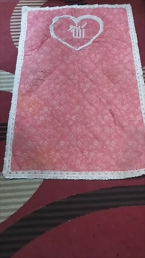 The pink prayer mat is very nice Stock Footage 293056451