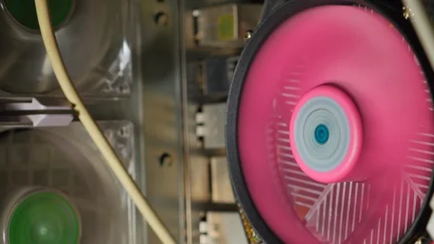 The Pink Processor Cooler On The Motherboard Is Spinning In Computer Case. Stock Footage 122348464