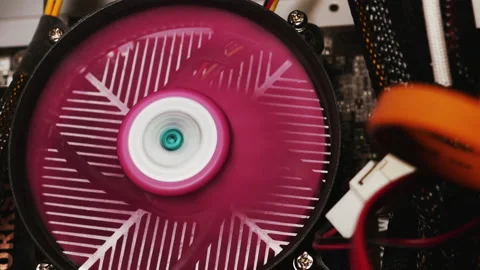 Pink Processor Cooler On The Motherboard Is Spinning In Computer Case. Stock Footage 149666624
