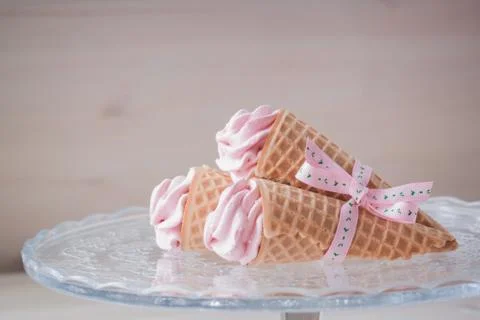Pink raspberry flavour marshmallows or zephyr on the wooden background Stock Photos